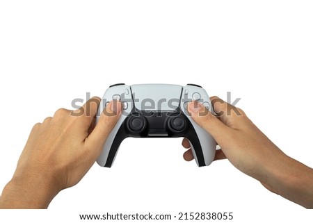 Video game console controller in hand gamer isolated on white background. Playful enjoyment concept. (With clipping path)