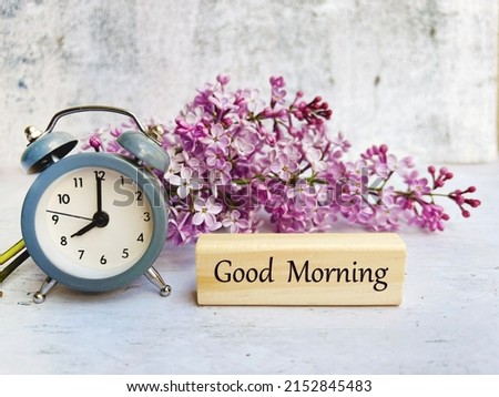 Cup of Coffee , Alarm Clock ,Good Morning Message and Purple Lilac Flowers 