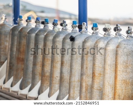 Row of oxigen tanks for scuba diving. Royalty-Free Stock Photo #2152846951