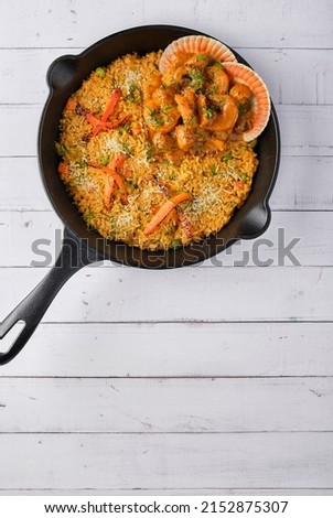 PERUVIAN FOOD: Rice with seafood. Arroz con Mariscos, food served in pan, Selective focus. Royalty-Free Stock Photo #2152875307