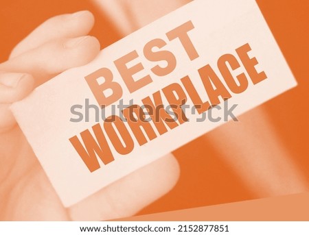 Businessman putting a card with text BEST WORKPLACE in the pocket. Human resources personnel management dream job concept.