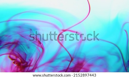 Mix multicolor paint ink drops in water background with copy space. drop of Ink color mix paint falling on water Colorful ink in water