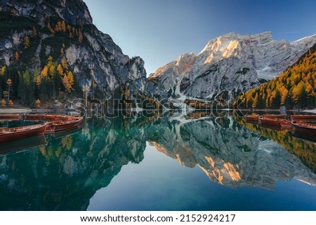 A quiet morning at Lago di Braies in the Italian Dolomites. The autumn mood of the photo creates a great atmosphere.