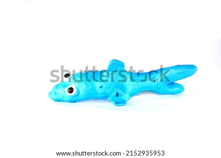 Plasticine shark. Plasticine toys on a white background