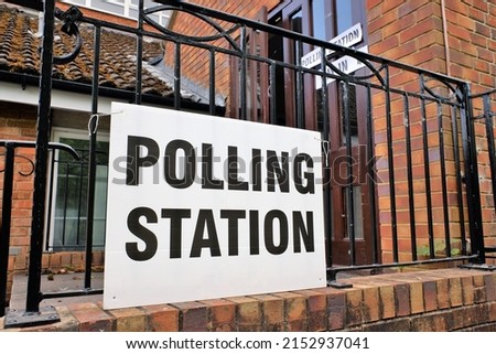 UK polling station sign outside church premises Royalty-Free Stock Photo #2152937041