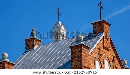 General view and close-up of architectural details of the sacred complex built in 1791, i.e. the belfry and the Catholic church of Saint John the Baptist in the town of Piski in Masovia in Poland. Royalty-Free Stock Photo #2152958915