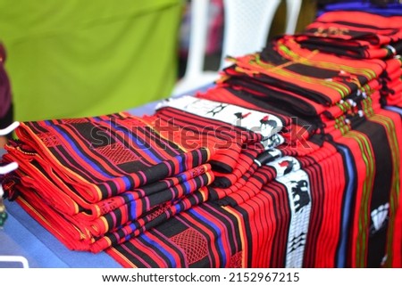 A colorful Naga shawl on display at a shop at Hornbill Festival, Nagaland, India Royalty-Free Stock Photo #2152967215