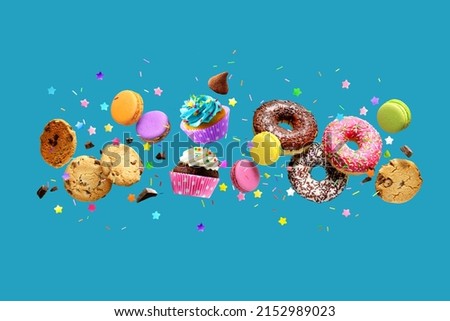 Cakes, sweets, confectionery collage background. Donuts, cookies cupcakes macaroons levitation over blue background Royalty-Free Stock Photo #2152989023