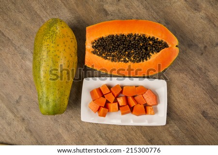 Fresh cut juicy tropical papaya mamao fruit with seeds at Brazilian 