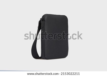 Side view on men's black leather business document shoulder bag. Small laptop briefcase diplomat purse for mens isolated on white background, mock up Royalty-Free Stock Photo #2153022211