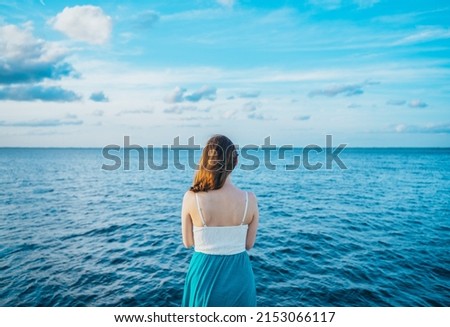 Young Beautiful Woman Standing on Sea Shore Close Up Photography 