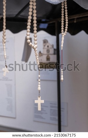 A closeup shot of  cross rosary hanging