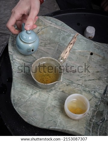 stock image of the tea cup oriental teapot.