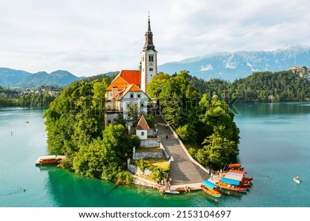 Aerial view of lake Bled with assumption of Mary Pilgrimage Church on the small island on the background of Julian Alps in Slovenia. Royalty-Free Stock Photo #2153104697