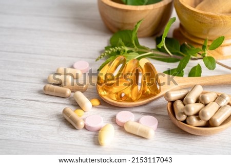 Alternative medicine herbal organic capsule drug with herbs leaf natural supplements for healthy good life. Royalty-Free Stock Photo #2153117043