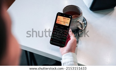 Online payment. Girl holding mobile phone with internet online bank app. Credit card wallet application. Online wallet save money