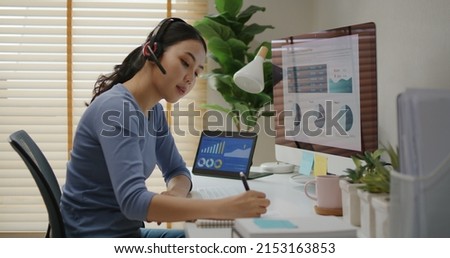 Asia people young casual woman remote work at desk home phone call talk study learn MBA online class. SEO sale plan report data chart graph on desktop PC screen reskill upskill career job workforce.