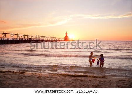 St Joseph Lighthouse on Lake Michigan at sunset Royalty-Free Stock Photo #215316493