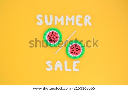 Two slices of watermelon and lettering Summer sale on yellow background. Banner with percentage sign. Promotion of the poster sale or percent discount in the store. Mock up, top view, flatlay concept