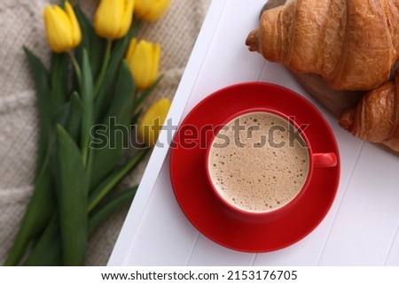 Morning coffee and croissants on white wooden tray, flat lay