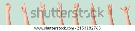 Set of hands showing different letters on green background. Sign language alphabet
