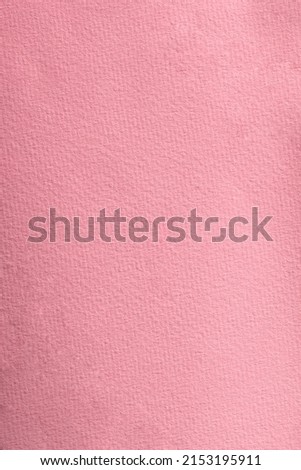 Pink color cardboard background. Texture of rose watercolor paper. High resolution photography.