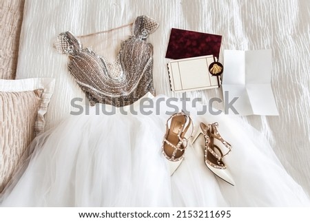 Ivory shoes on a wedding dress. Wedding preparation Royalty-Free Stock Photo #2153211695