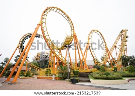 Roller coaster on white background Royalty-Free Stock Photo #2153217539