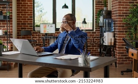 Company employee analyzing executive website report on laptop, using application statistics to write business email. Project manager working with corporate recearch information on pc.