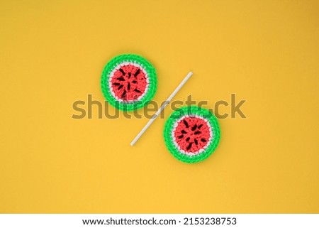 Two slices of watermelon on yellow background. Banner with percentage sign. Promotion of the poster summer sale or percent discount for sale in the store. Mock up, top view, flatlay concept
