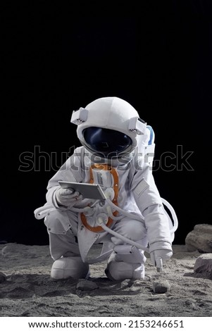 Astronaut using tablet in space