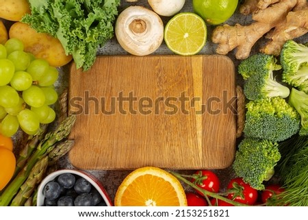 fresh fruits and vegetables arranged as frame and empty space for your text