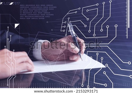 A client is signing a contract to create new software to present it in start-up conference. Technological graph over the desk.