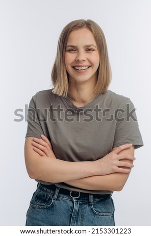 portrait of a young beautiful girl with braces, on a white background