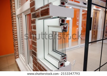Section of window profile with metal, glass and insulation.Window profile cut of with metal, glass and insulation