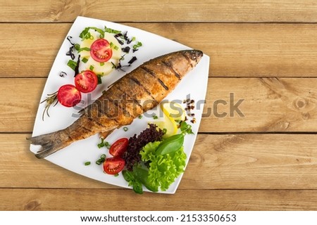 Fresh Fish with spice and lemon on desk Royalty-Free Stock Photo #2153350653