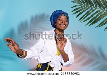 Photo of zulu cute lady in national summer accessories dance tribe green leaves isolated on shade colored background Royalty-Free Stock Photo #2153350953