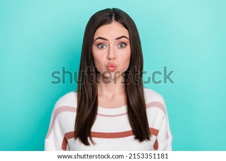 Photo of funny flirty woman wear striped sweater sending you kiss isolated turquoise color background