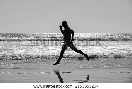 endurance and stamina. sport athlete run fast to win in sea. morning workout activity. Royalty-Free Stock Photo #2153353209