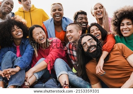 Group of multiracial people enjoy day at city park - Diverse young friedns having fun outdoor Royalty-Free Stock Photo #2153359331