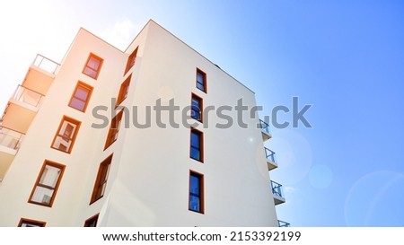 Modern luxury residential flat. Modern apartment building on a sunny day. Apartment building with a blue sky. Facade of a modern apartment building. Royalty-Free Stock Photo #2153392199