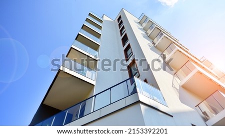 Modern luxury residential flat. Modern apartment building on a sunny day. Apartment building with a blue sky. Facade of a modern apartment building. Royalty-Free Stock Photo #2153392201