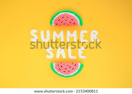 Two slices of watermelon and lettering Summer sale on yellow background. Banner with percentage sign. Promotion of the poster sale or percent discount in the store. Mock up, top view, flatlay concept
