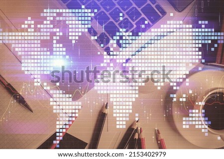 Business theme hologram drawings over computer on the desktop background. Top view. Multi exposure. Concept of international connections.