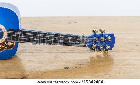 Guitar toy on table
