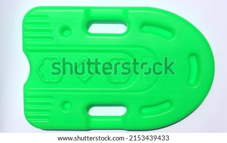 Swimming floating board on a white background. Green swimming floating board.
					 Royalty-Free Stock Photo #2153439433