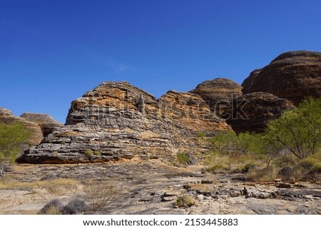 Eroded sandstone cliffs set against the stunning blue sky'
