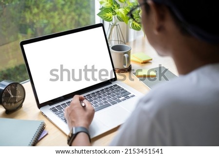Man working from home on laptop while sitting at the living room.