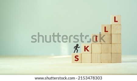 Upskilling and personal development concept. Skill training, education, learning, ability, knowledge and competency  for digital transformantion. Upskilling, reskilling, new skills icon on wooden cube