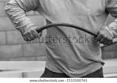 a man bent an iron crowbar with his hands